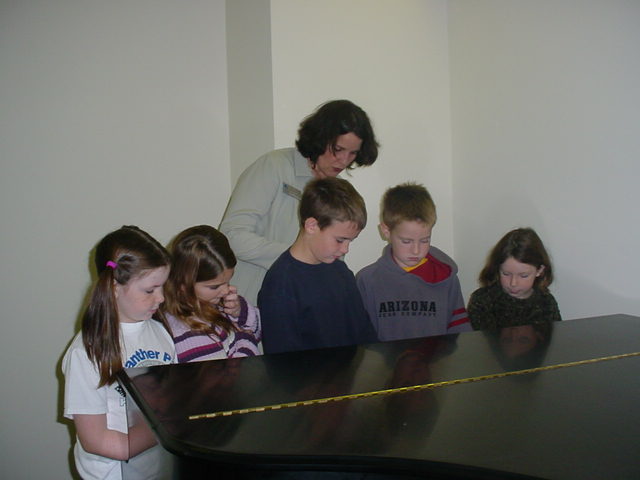 Dr. Poulter with the piano