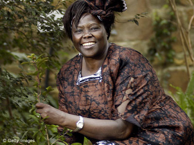Wangari Maathai next to a tree